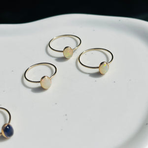 three rings sitting on top of a white plate